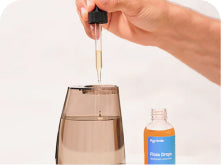 Add 3–5 drops of flossdrops